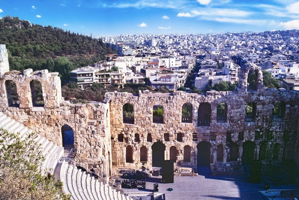 The Greek Landmark of the Odeon underrneath the Acropolis bathed in late evening sunlight